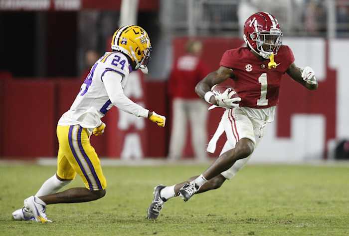 Alabama receiver Jameson Williams (1) runs past LSU defensive back Darren Evans (24). Mandatory Credit: Gary Cosby Jr.-USA TODAY Sports